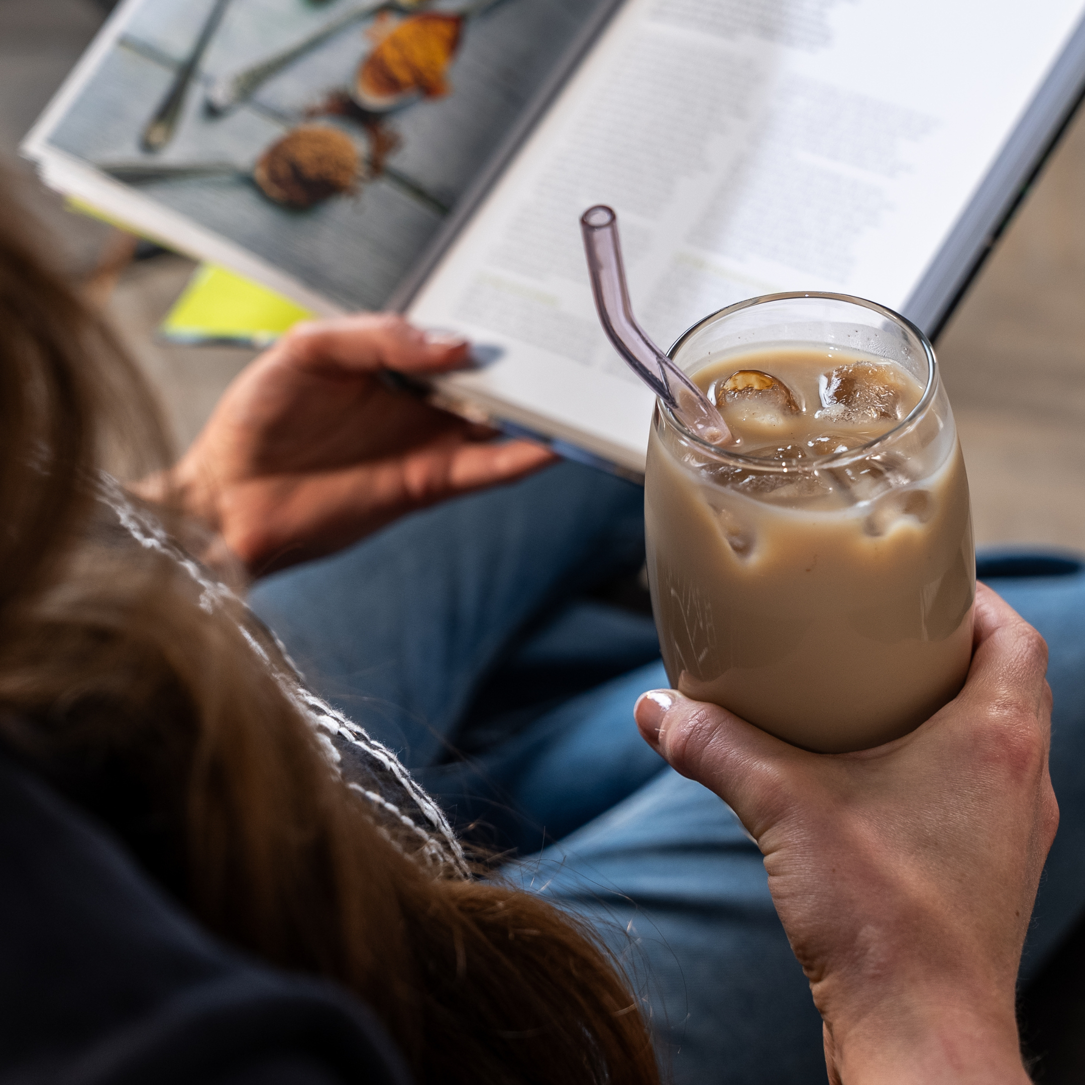lady holding iced spiced chai latte