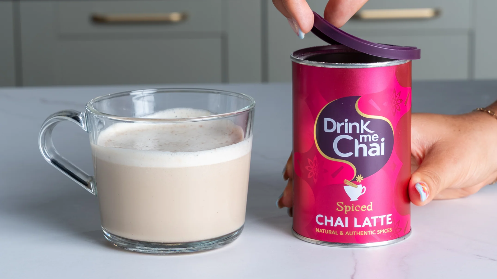spiced chai latte in tub open on kitchen worktop with made chai alongside